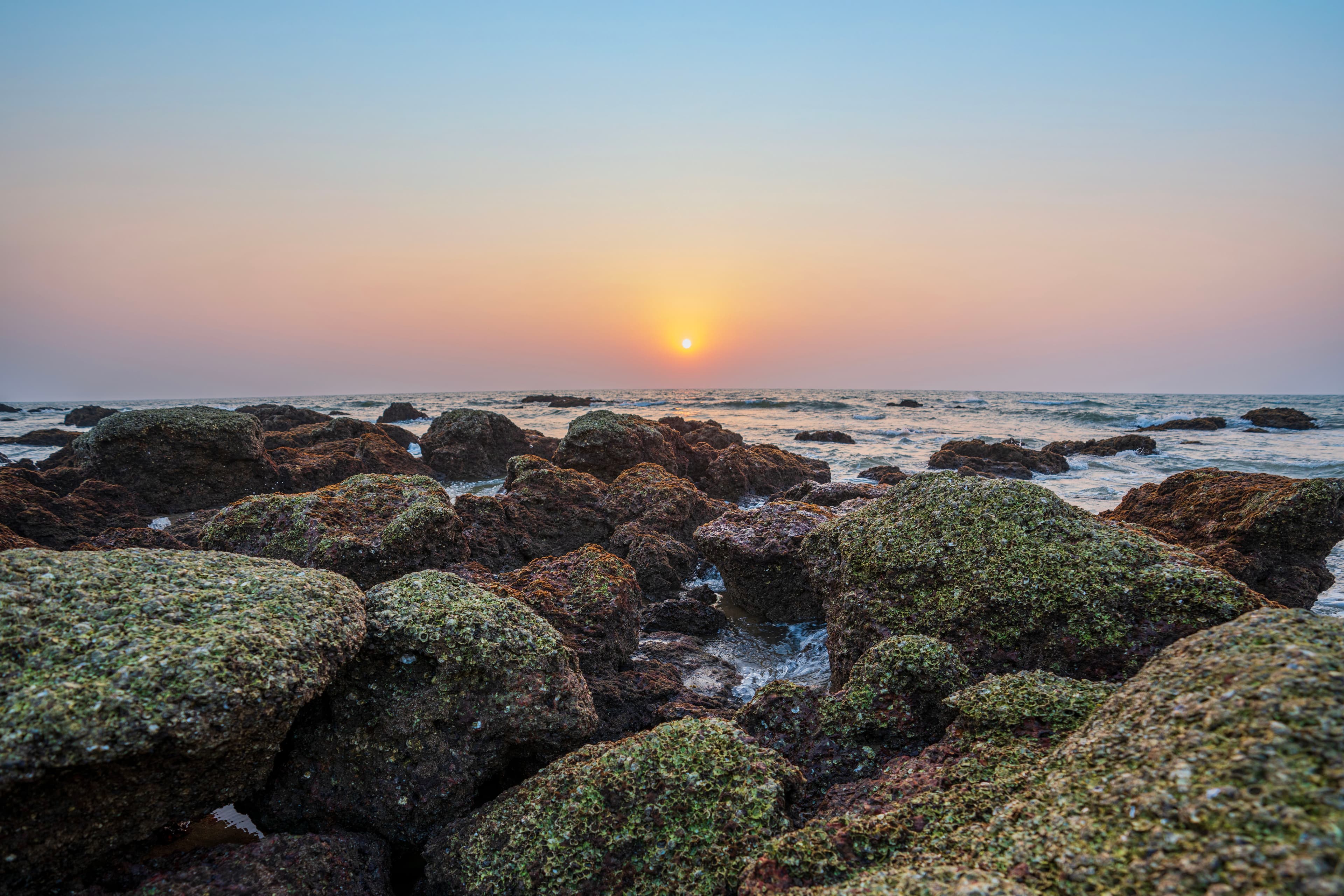 Sunset Over Sea Rocks – Tranquil Twilight at Galgibaga Beach