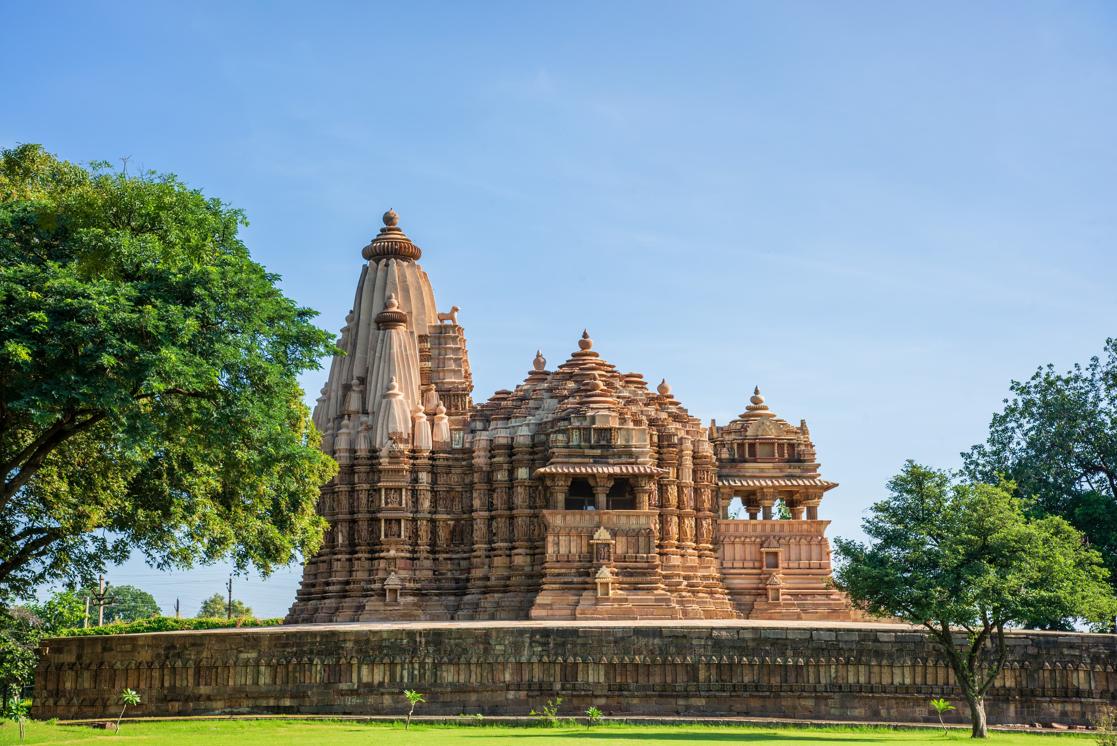 Scenic View of Khajuraho’s Vishwanath Temple Framed by Nature