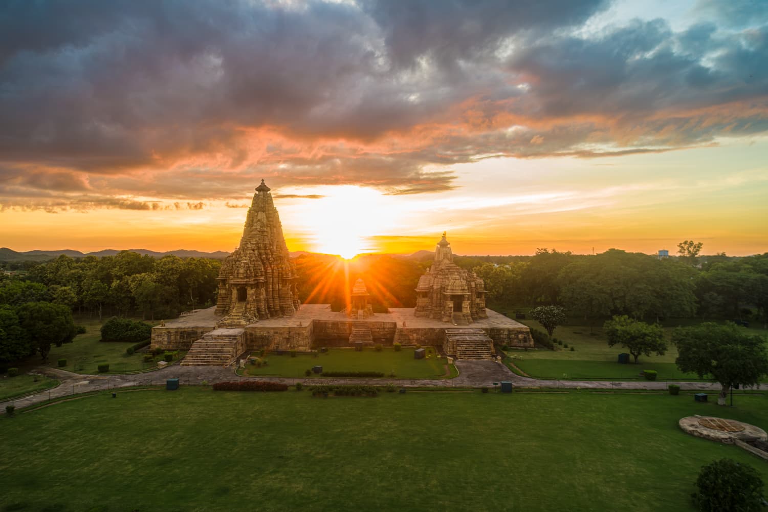 Sunset Serenity Over Khajuraho Temples – Aerial Magic in Madhya Pradesh