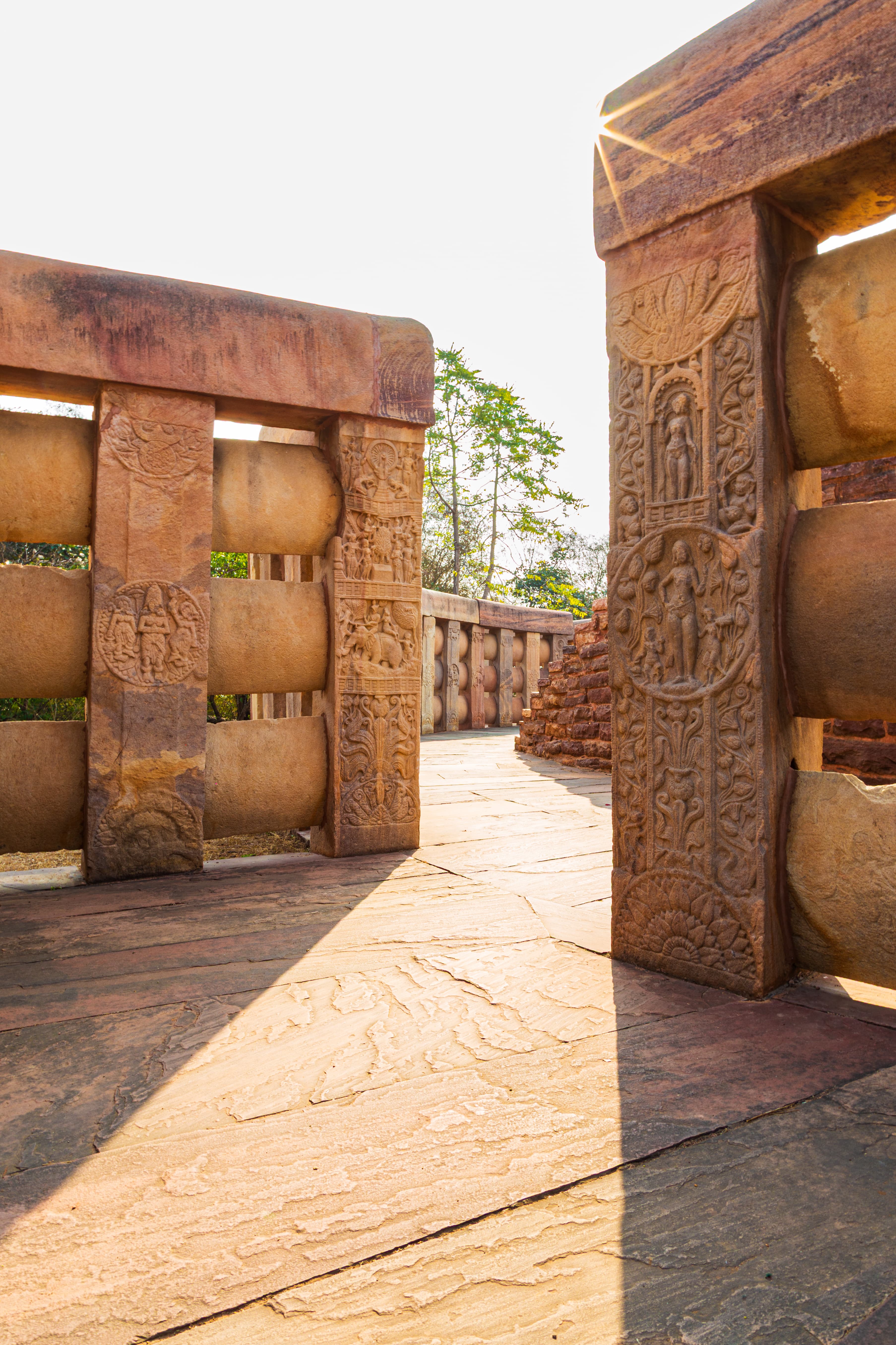 Sacred Light at Sanchi – Sunlit Carvings on the Stone Railing