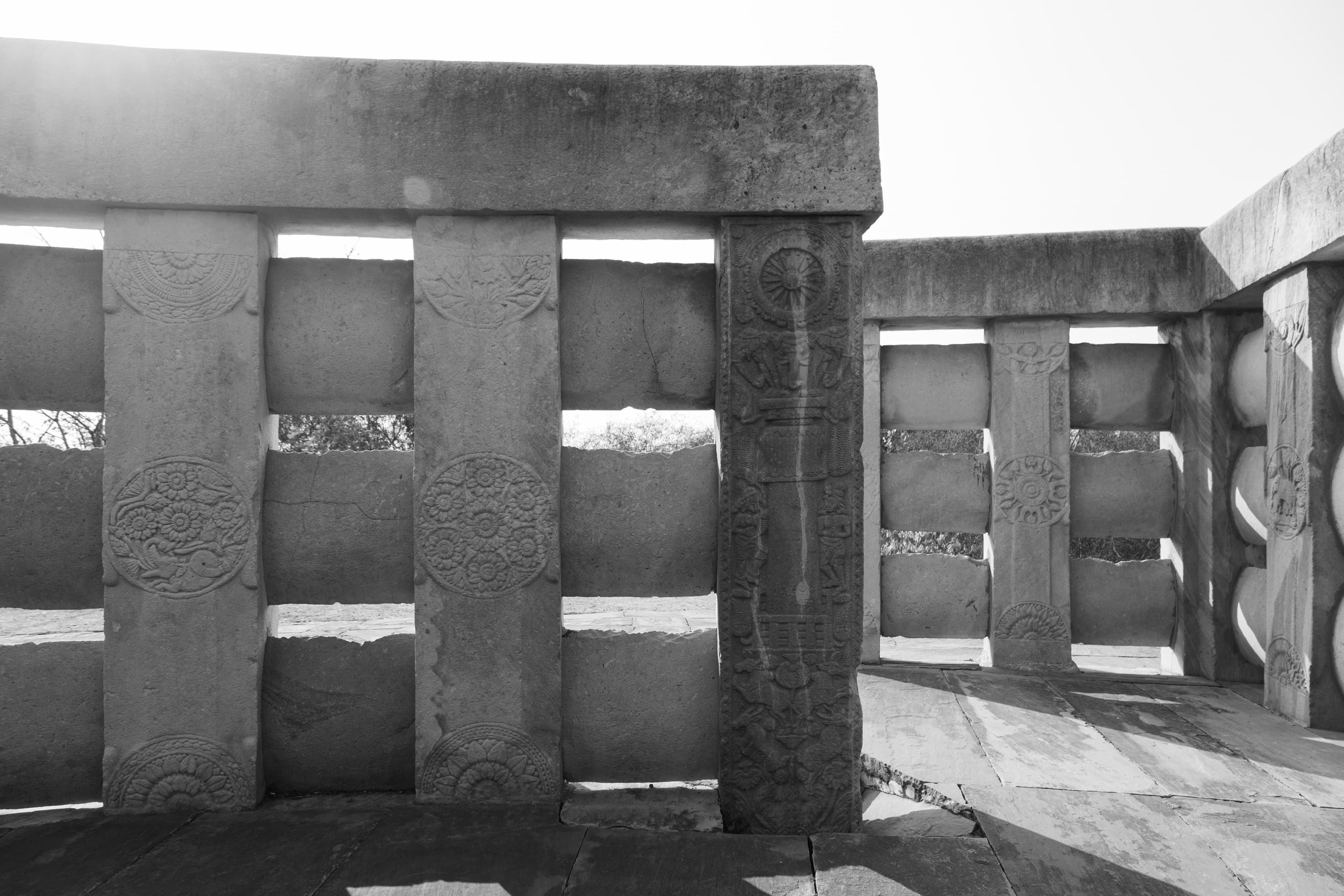 Ashokan Pillar Relief & Floral Motifs – Stone Railing Art at Sanchi Stupa