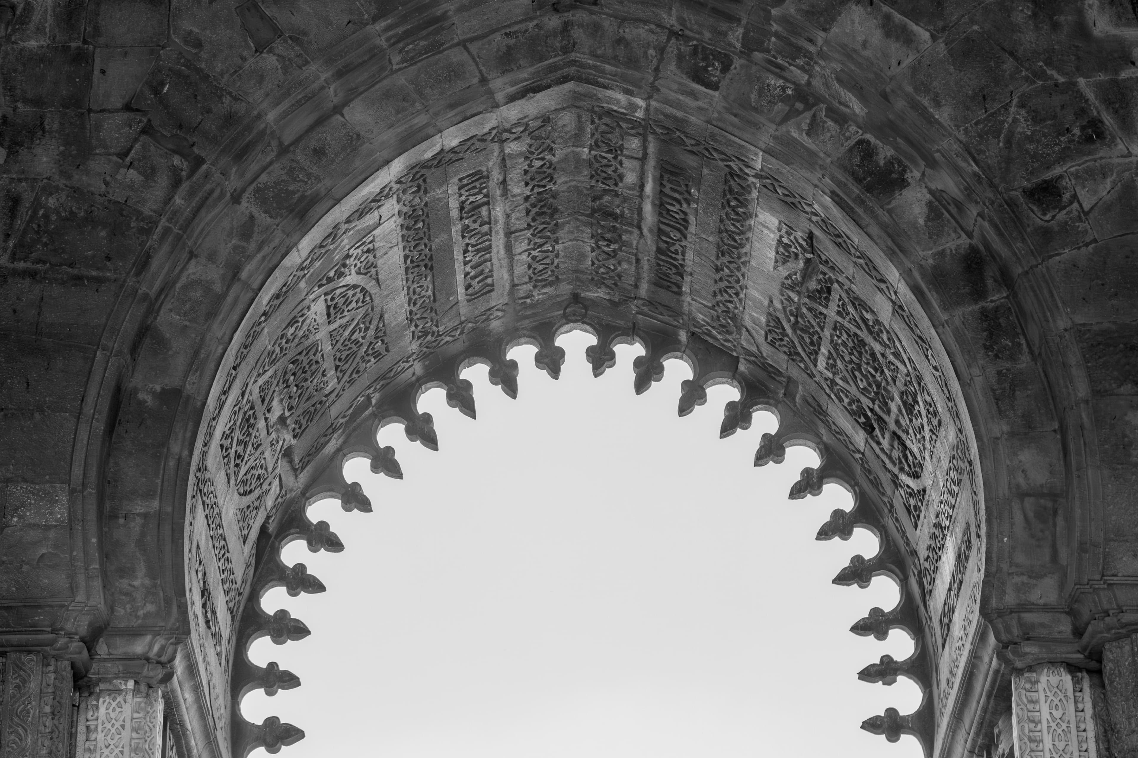 Ornate Arch of Qutub Complex – A Glimpse into Indo-Islamic Art